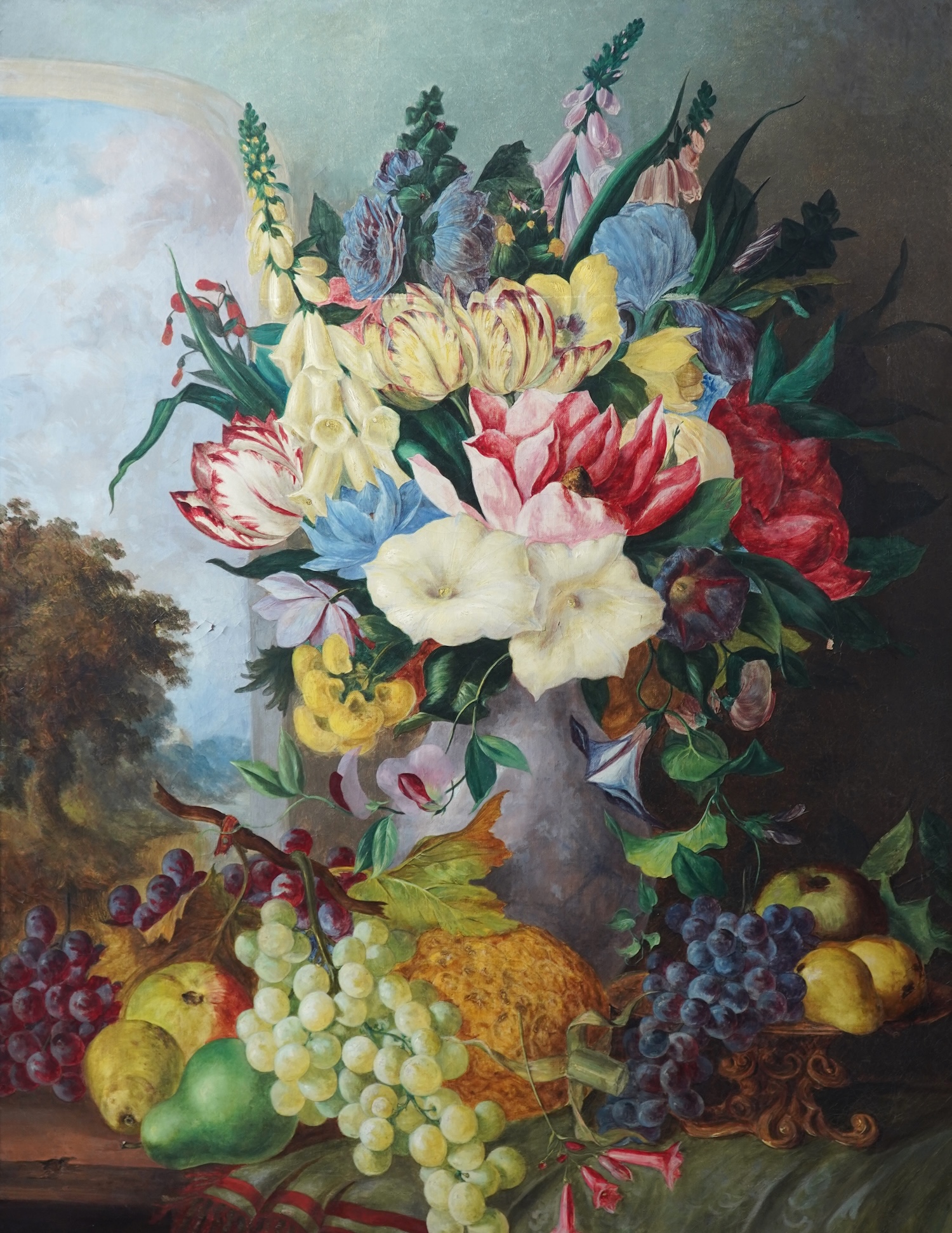 English School, 19th century, A still life study of flowers and fruit before a landscape